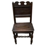 A 17TH/18TH CENTURY OAK NORTH COUNTRY STANDARD CHAIR With pierced crest, panelled back and solid