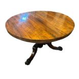 A WILLIAM IV ROSEWOOD BREAKFAST TABLE Raised on a turned mahogany column supported on three