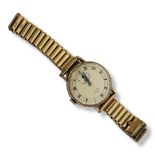 SMITHS, DE LUXE, A VINTAGE 9CT GOLD GENT’S WRISTWATCH Circular silver tone dial with Roman markings,