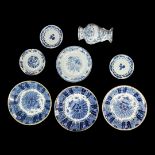 DELFT, THREE EARLY 20TH CENTURY DUTCH CHARGERS Monochrome painted in blue and white with a basket of