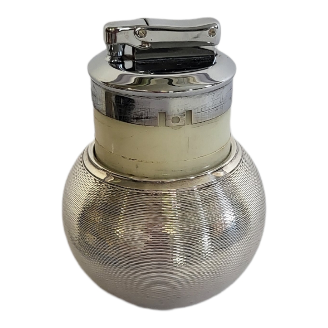 A VINTAGE SILVER SPHERICAL TABLE LIGHTER With textured design, marked to base 'Witchball by - Image 2 of 2