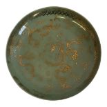 A CHINESE CELADON SPHERICAL POTTERY BOWL With gilt decoration of five toed dragons, bearing a six