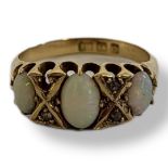 AN EARLY 20TH CENTURY 18CT GOLD, OPAL AND DIAMOND RING Having three graduated oval cabochon cut