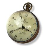 A GLASS AND BRASS MECHANICAL BALL DESK CLOCK With ‘Omega’ displayed on face, Roman numerals. (