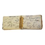 A VINTAGE AUTOGRAPH BOOK Containing numerous signatures of football, rugby and cricket players of