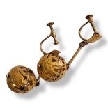 A PAIR OF VINTAGE CONTINENTAL YELLOW METAL DROP EARRINGS With spherical drops and a pierced animal