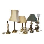 A COLLECTION OF EIGHT VARIOUS SOLID BRASS TABLE LAMPS Consisting of a near pair of brass Gothic