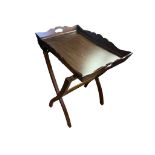 A RECTANGULAR MAHOGANY TRAY TABLE With raised sides with open hand holds on both sides, the tray