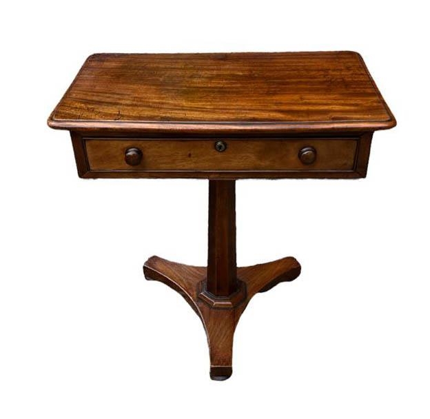 AN EARLY VICTORIAN MAHOGANY OCCASIONAL TABLE Fitted with a single drawer, raised on a faceted