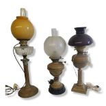 A VICTORIAN OIL LAMP With clear cut glass reservoir, on a reeded tapering Corinthian column,