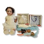 A LATE 19TH/EARLY 20TH CENTURY CONTINENTAL CHARACTER BISQUE BABY DOLL A large Bisque character doll,