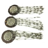 A COLLECTION OF THREE EARLY 20TH CENTURY BERLIN IRON EPAULETS Decorated with a circular silvered