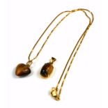 AN 18CT GOLD TIGER'S EYE PENDANT NECKLACE The carved heart form stone on a fine link chain, together