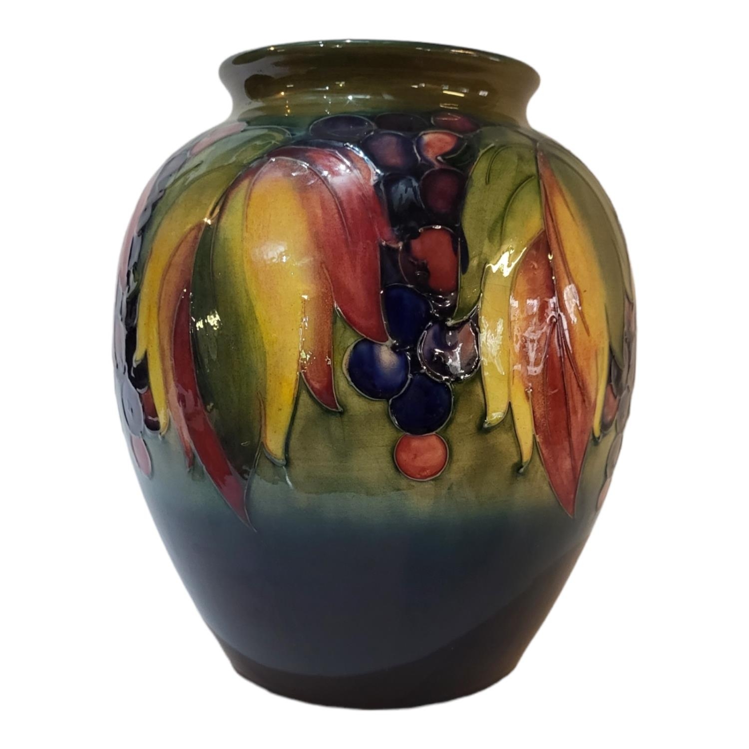 A LARGE ART DECO PERIOD WILLIAM MOORCROFT POTTERY EXHIBITION SIZE OVOID VASE With everted rim,