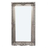 A LARGE RECTANGULAR ROCOCO STYLE MIRROR Champagne silvered with shell decorated corners and bevelled