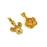 A VINTAGE 22CT GOLD PENDANT Pierced form with textured bale, together with a yellow metal filigree