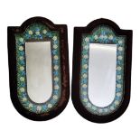 A PAIR OF EARLY 20TH CENTURY CONTINENTAL FLORAL PORCELAIN MIRRORS Fine arrangement of flowerheads in