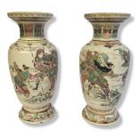 A PAIR OF LARGE MEIJI PERIOD JAPANESE CERAMIC VASES Decorated with Samurais. (h 40cm) Condition: