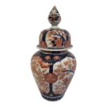 A 19TH CENTURY JAPANESE MEIJI PORCELAIN IMARI GINGER JAR AND COVER Having an onion form finial and