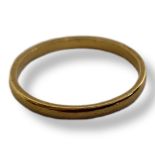 AN EARLY 20TH CENTURY PLAIN 22CT GOLD WEDDING RING. (size P) Condition: good