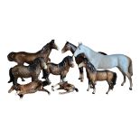 A VINTAGE COLLECTION OF BESWICK PORCELAIN HORSES To include a dapple grey, two Shetland ponies,