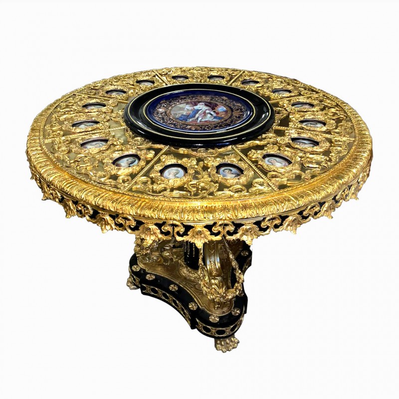 A LARGE LOUIS XVI REVIVAL BRONZE MOUNTED CENTRE TABLE Inset with Sèvres style porcelain portrait