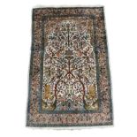 A KASHMIRI TREE OF LIFE RUG The central field with beast and birds contained within three running