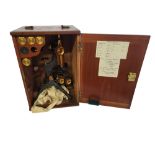 W. WATSON AND SONS, A VICTORIAN GILT BRASS AND BLACK LACQUER MICROSCOPE In a fitted mahogany box,