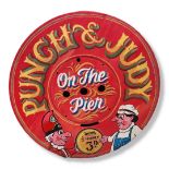 A WOODEN CIRCULAR FAIRGROUND SIGN Promoting Punch & Judy on the pier, painted in bright colours. (