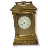 A FRENCH GILT BRASS REPEATING CARRIAGE CLOCK Having a single handle and applied classical form