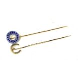 TWO WHITE METAL STICK PINS Horseshoe and a circular blue enamel one. (approx length 8cm)