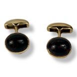 ASPREY, A PAIR OF 9CT GOLD AND HARDSTONE GENT’S CUFFLINKS Set with oval cabochon cut stones. (approx