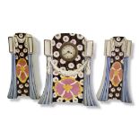 AN ART NOUVEAU BELGIUM GLAZED FAIENCE THREE PIECE CLOCK GARNITURE Painted with stylised symmetric