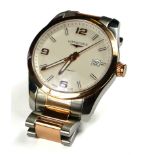 LONGINES, CONQUEST, AN 18CT ROSE GOLD AND STAINLESS STEEL GENT’S AUTOMATIC WRISTWATCH The circular