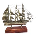 A LARGE 20TH CENTURY SILVER PLATED MODEL OF A THREE MASTED SCHOONER ON LACQUERED WOOD BASE Fully