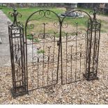 A DECORATIVE IRON DOUBLE GATE With posts, the scroll work figured with perched birds. (w 130cm x h