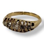 AN EARLY 20TH CENTURY 18CT GOLD AND DIAMOND FIVE STONE RING The single row of graduated round cut