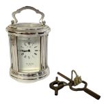 L'EPEE, A FRENCH SILVER PLATED COMMEMORATIVE CARRIAGE CLOCK cylindrical form with single carry