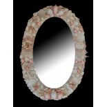 A 20TH CENTURY ORNAMENTAL LADIES’ OVAL SEASHELL AND CORAL WALL MIRROR Set with various exotic