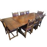 A 17TH CENTURY STYLE LARGE OAK DRAW LEAF TABLE Complete with eight matching chairs including two