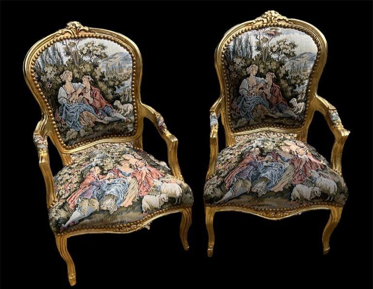 A PAIR OF BAROQUE STYLE GILTWOOD TAPESTRY SALON CHAIRS Upholstery depicting courting couples. (