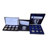 A COLLECTION OF THREE CUPRONICKEL COMMEMORATIVE COIN PROOF SETS Comprising a Centenary of World