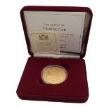 A 22CT GOLD FIVE POUND 'TRAFALGAR' PROOF COIN, DATED 2005 With HMS Victory, Nelson's flagship in