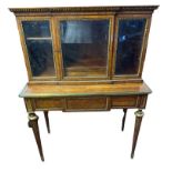 A 19TH CENTURY FRENCH KINGWOOD AND BRASS BANDED BONHEUR DU JOUR The breakfront three bevelled glazed