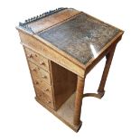 A VICTORIAN BIRDSEYE MAPLE DAVENPORT DESK With brass gallery above a tooled leather surface,
