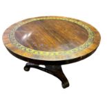 A REGENCY PERIOD ROSEWOOD AND BRASS INLAID BREAKFAST TABLE The circular top on turned column with