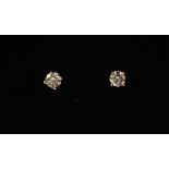 A PAIR OF 18CT ROSE GOLD FOUR CLAW SOLITAIRE DIAMOND STUDS Boxed. (diamond total 0.44ct)