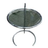 AN EILEEN GRAY DESIGN CIRCULAR CHROME AND GLASS ADJUSTABLE TABLE. (h 52cm x diameter 51cm)