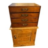 AN AESTHETIC MOVEMENT WALNUT COLLECTOR’S CHEST Of four long drawers fitted with brass handles,