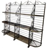 A LARGE ANTIQUE FRENCH IRON AND BRASS FOUR SECTION THREE TIER BAKER’S RACK With scrolling
